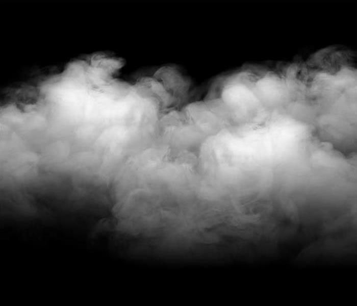 Grey and white smoke on a black background. 