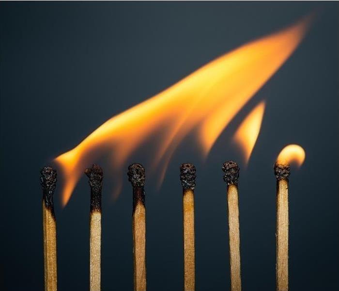 Tips of several matches, in a row, burning.