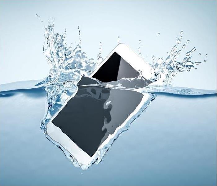 Electronic device splashing into a pool of water